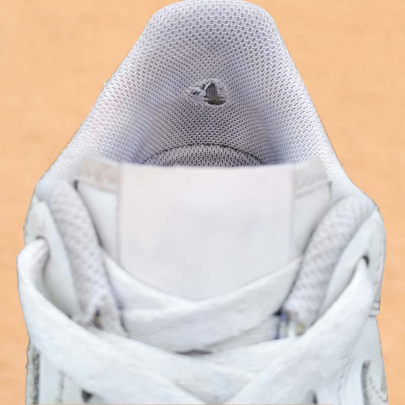 Trainer with heel hole